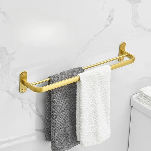 Geborsteld goudkleurige aluminium handdoekrekplank